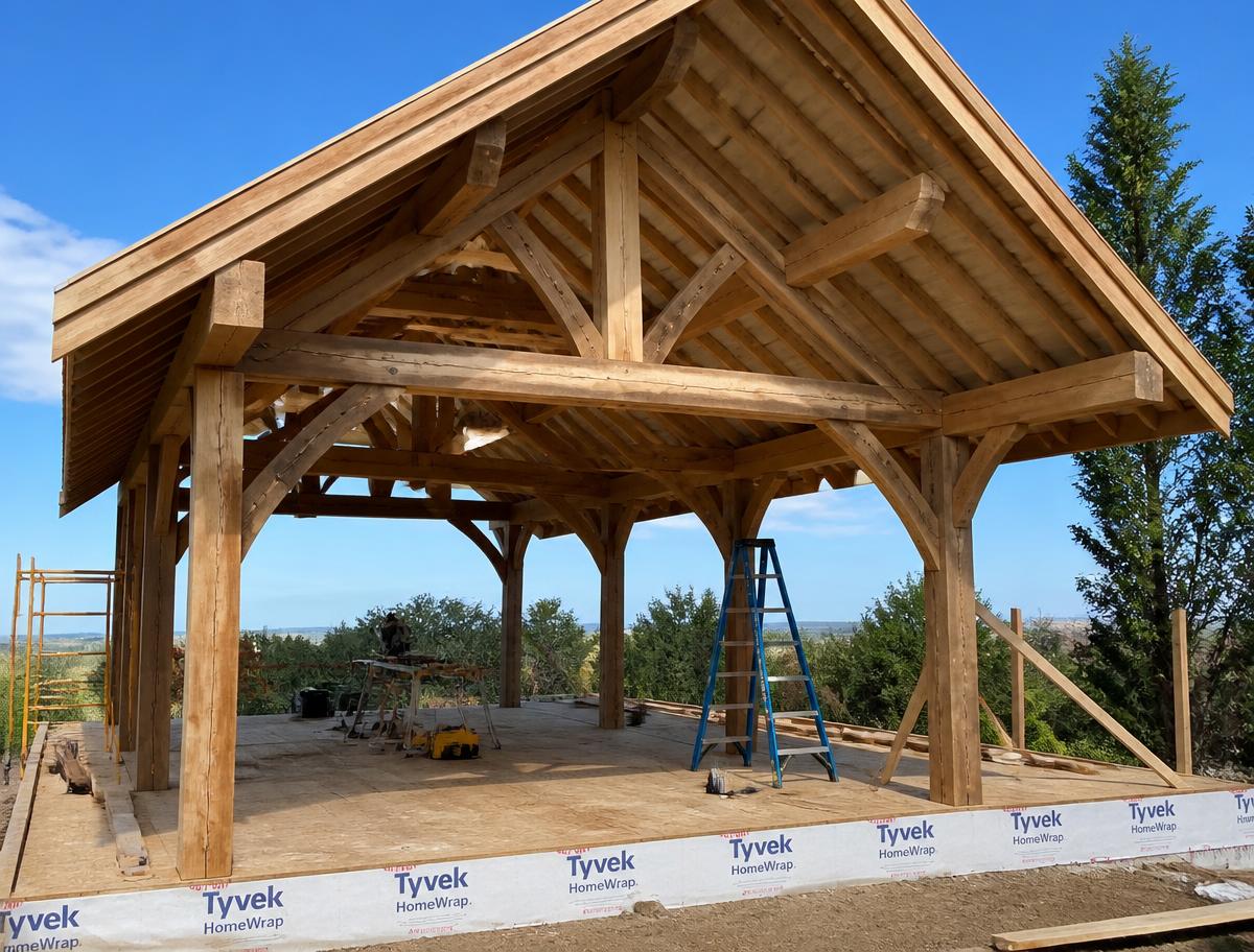 TWT crew constructing the framing of a covered outdoor structure