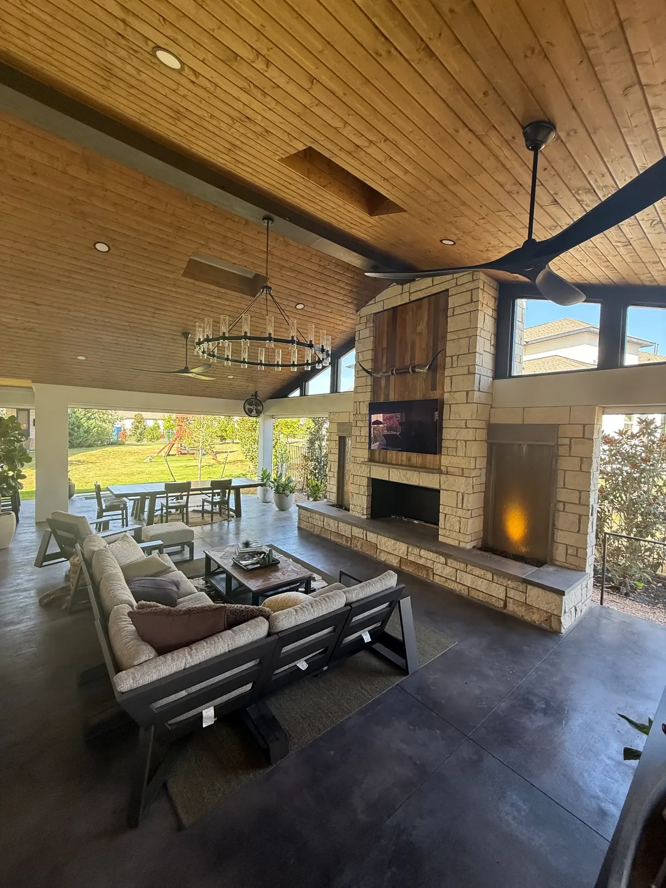TWT-built vaulted covered living space with stone fireplace