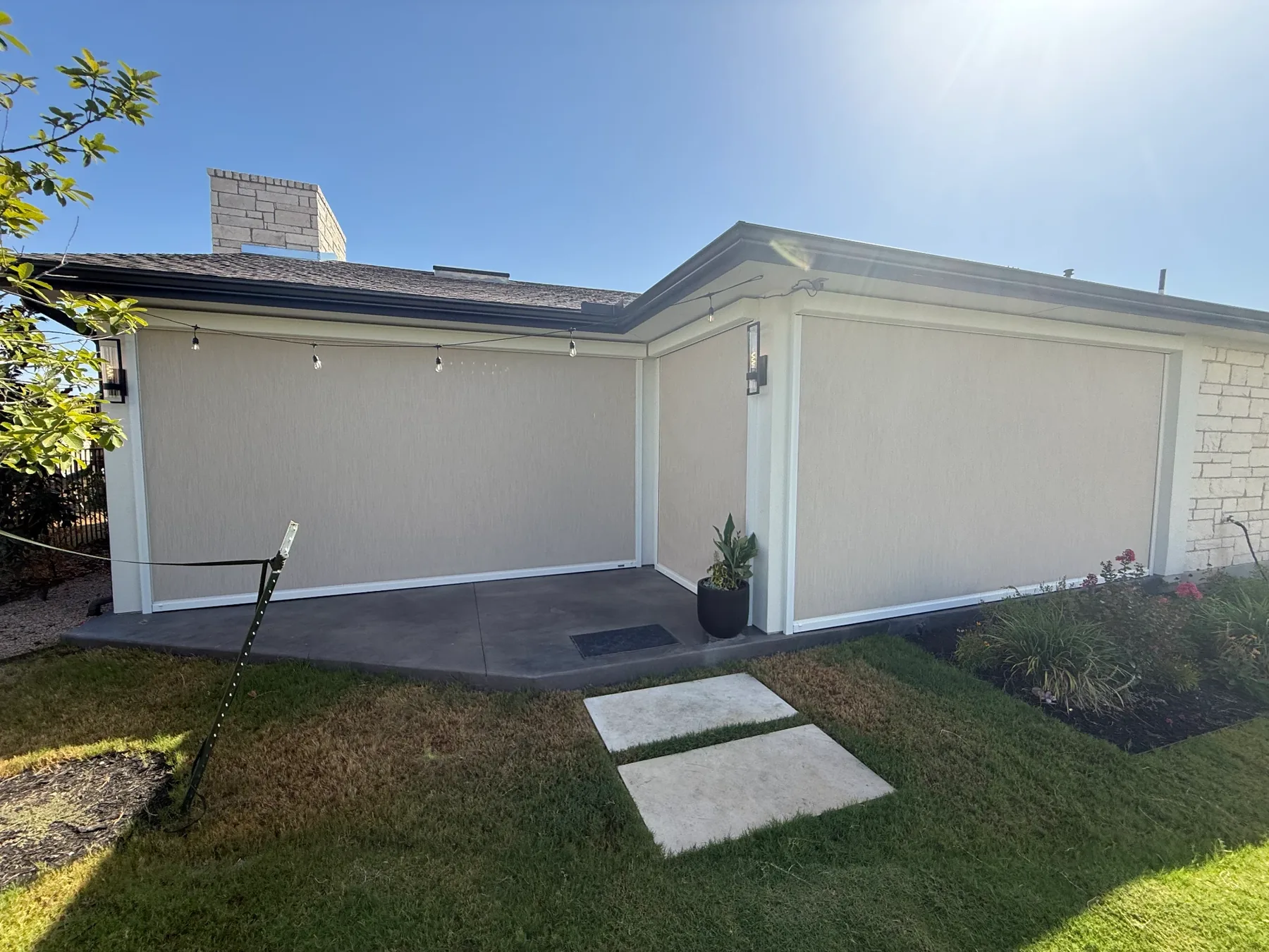 MagnaTrack retractable screens enclosing a covered patio on a Rough Hollow project