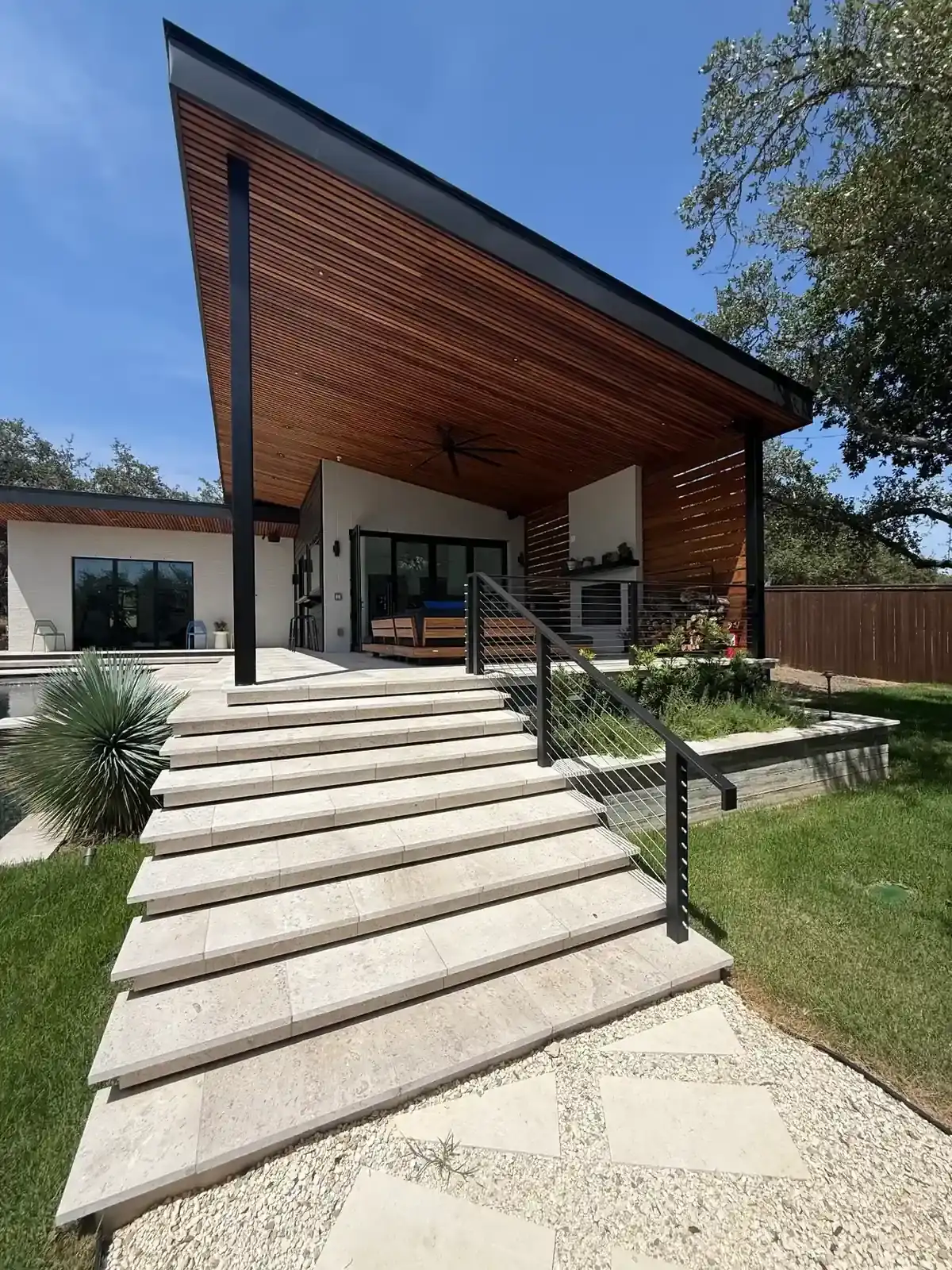 Completed TWT poolside pavilion and pool house beside a swimming pool