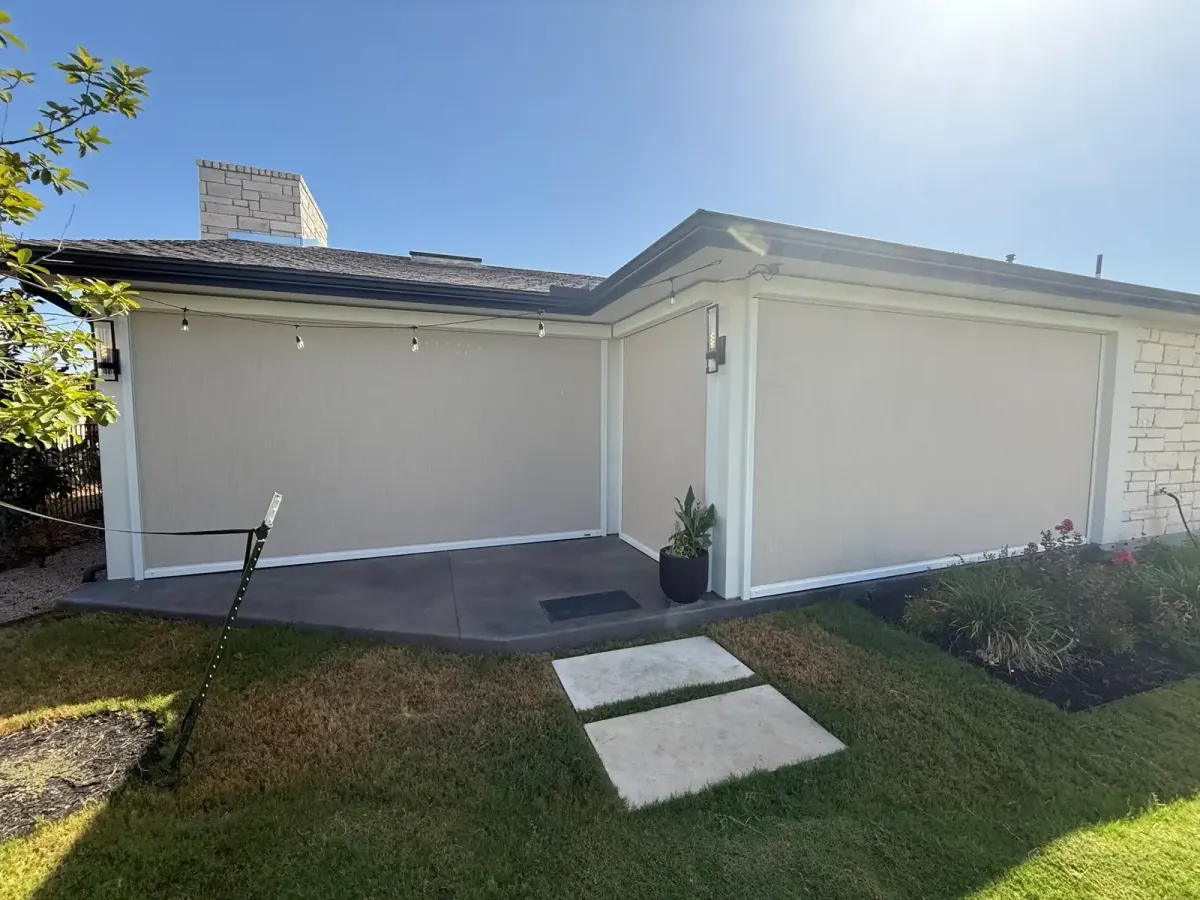 MagnaTrack retractable screens enclosing a covered patio on a Rough Hollow project