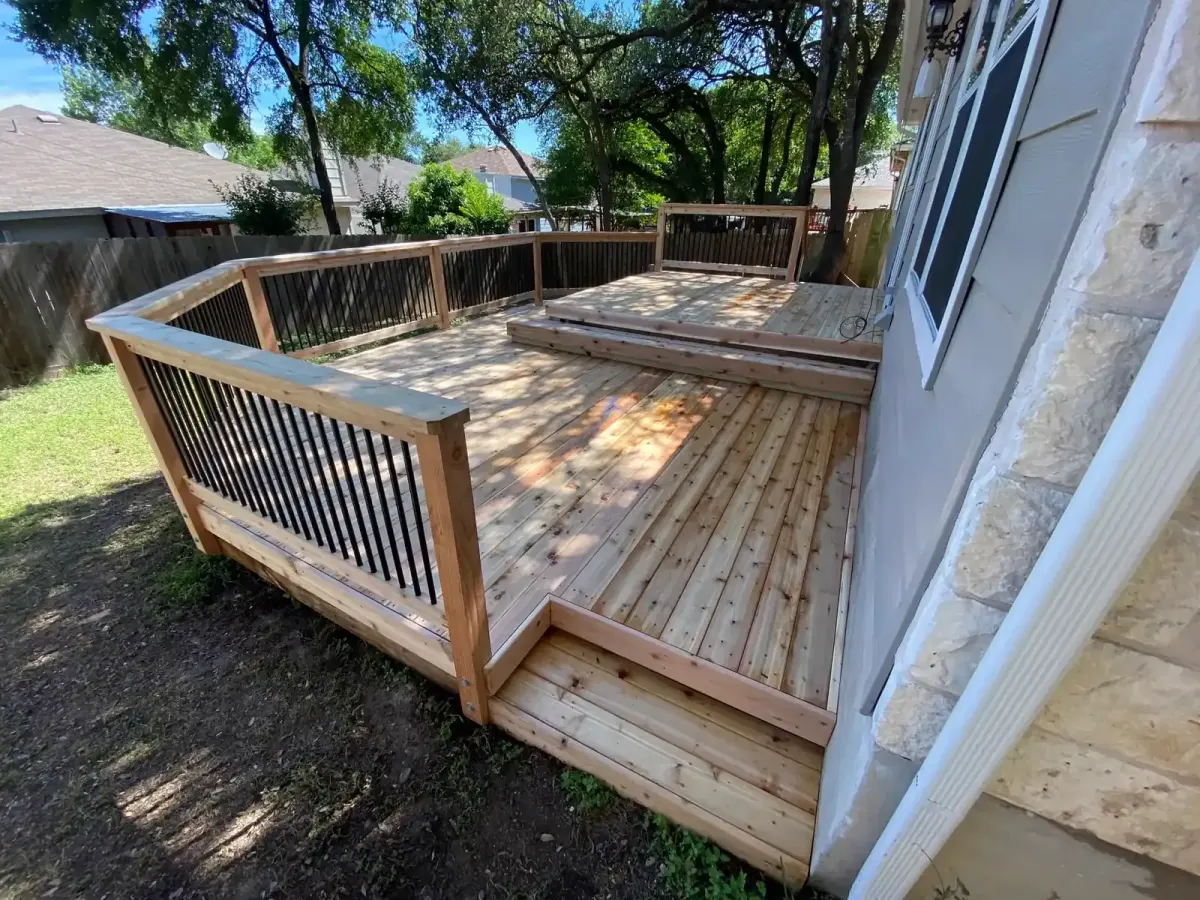 Custom freestanding deck structure in a backyard